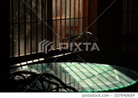 Table by the window in a retro room Table by the window in a retro room 107640684