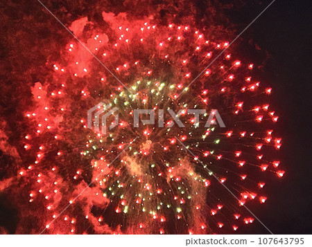 Summer night sky fireworks display Summer night sky fireworks display 107643795