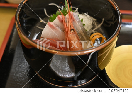 Mouth of a woman eating rice Mouth of a woman eating rice 107647333