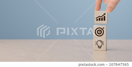 business strategy and future sustainable. finance action plan. Hand holding business growth chart on wooden cubes. objective target and success and business idea concept. 107647565