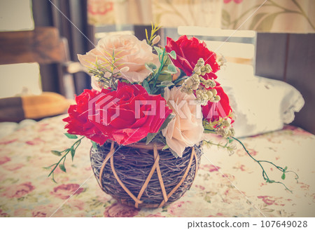 beautiful bouquet of bright flowers in basket 107649028