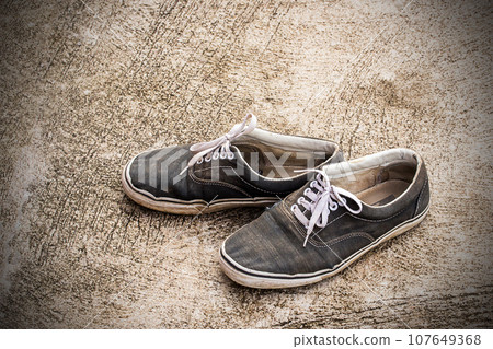 Dirty old shoes 107649368
