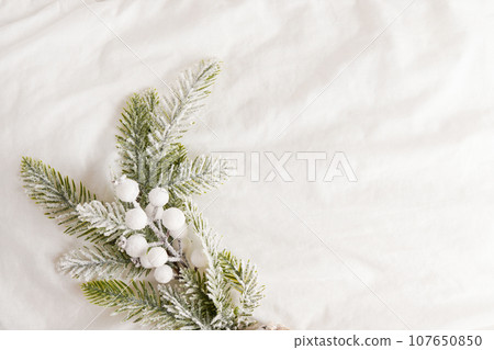 White bed background with Christmas branch, copy space 107650850