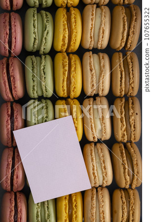 macaroons of different colors on a black background macaroons of different colors on a black background 107655322