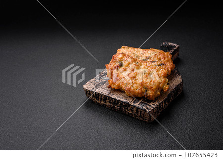 Delicious fried chicken chop or pork meat fried breaded with salt, spices and herbs Delicious fried chicken chop or pork meat fried breaded with salt, spices and herbs 107655423