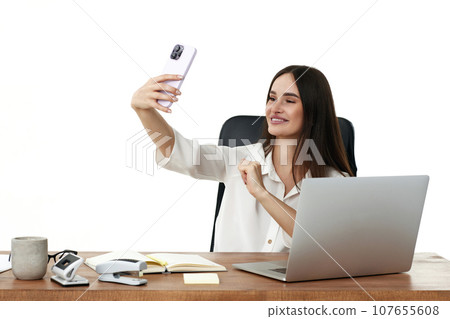 happy beautiful young woman in white shirt takes selfie happy beautiful young woman in white shirt takes selfie 107655608