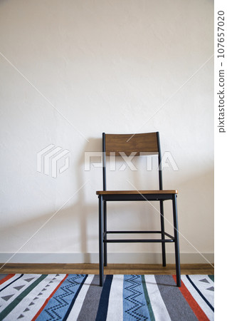 Chair with carpet in vertical composition Chair with carpet in vertical composition 107657020