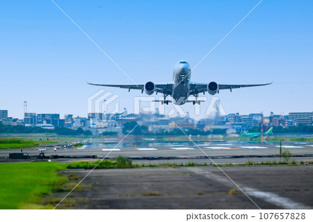 Jet plane taking off from Fukuoka Airport in the blue sky 107657828