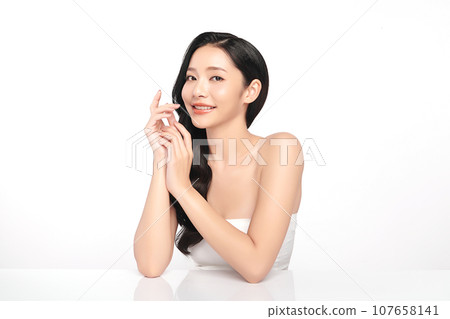 Beautiful young asian woman with clean fresh skin on white background, Face care, Facial treatment, Cosmetology, beauty and spa, Asian women portrait. Beautiful young asian woman with clean fresh skin on white background, Face care, Facial treatment, Cosmetology, beauty and spa, Asian women portrait. 107658141