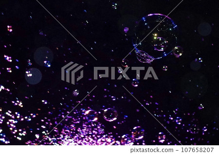 soap bubbles in the night sky 107658207