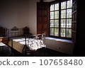 by the window of an old-fashioned house 107658480