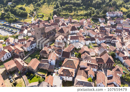 Aerial view of Isaba township with Saint Cyprian church in Pyrenees, Navarre 107659479