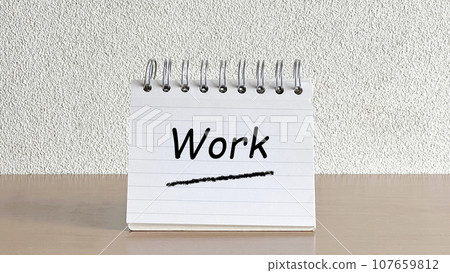 Memo pad on the table_front_with Work text Memo pad on the table_front_with Work text 107659812