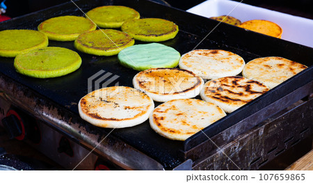 Arepas from corn meal, Venezuelan traditional fast street food 107659865