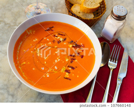 Spanish salmorejo cordobes - typical spanish tomato soup with ham 107660148