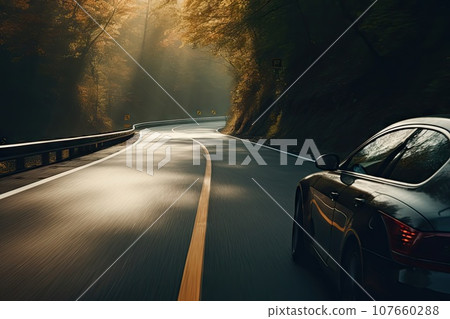 a car driving on a road in the middle of the image is blurred and blured by the sun's rays a car driving on a road in the middle of the image is blurred and blured by the sun's rays 107660288