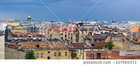 view of the rooftops, Isaac Cathedral and lakhta Centre tower in Saint Petersburg during the rain 107660351