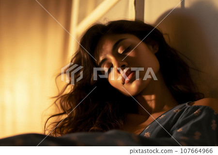 Relaxed woman on couch Blissful wellness. 107664966