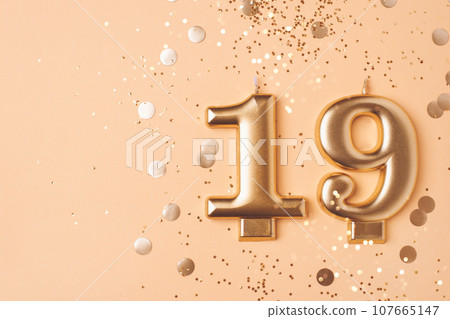Gold candles in the form of number nineteen. Gold candles in the form of number nineteen. 107665147