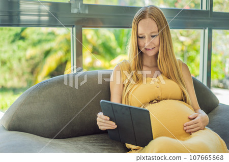 Mobile pregnancy online maternity application. Pregnant mother using phone. Pregnancy, medicine, pharmaceutics, health care and people concept Mobile pregnancy online maternity application. Pregnant mother using phone. Pregnancy, medicine, pharmaceutics, health care and people concept 107665868