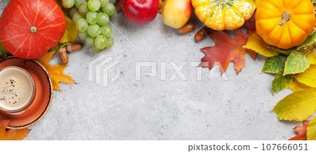 Autumn backdrop with pumpkins and fruits Autumn backdrop with pumpkins and fruits 107666051