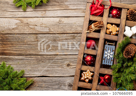 Wooden box with Christmas decor and toys Wooden box with Christmas decor and toys 107666095