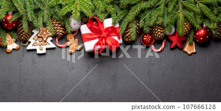 Xmas fir tree branch, Christmas gift box and space Xmas fir tree branch, Christmas gift box and space 107666128