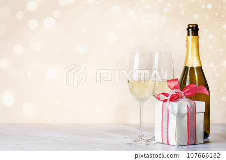 Two champagne glasses and gift box Two champagne glasses and gift box 107666182