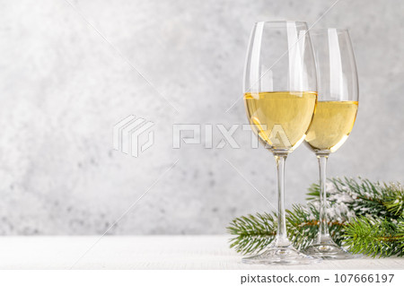 Christmas fir tree branches and champagne 107666197