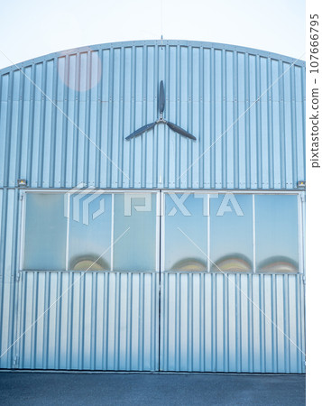 Old carbon propellers on hall wall at airport Old carbon propellers on hall wall at airport 107666795