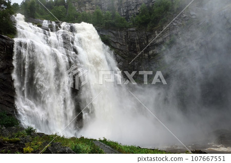 Waterfall on mountain rocks in Iceland. Icelandic natural landscape 107667551
