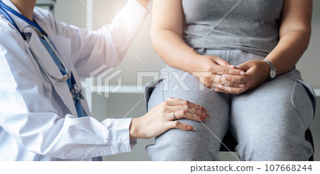 female doctor touch comfort mature Caucasian patient in modern private hospital 107668244