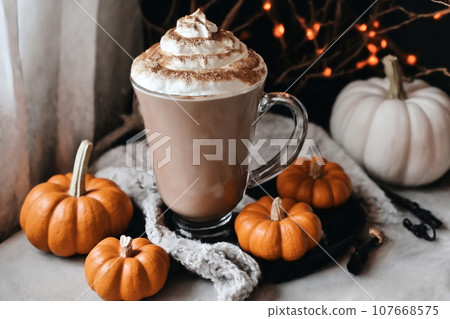 still life for halloween holiday, home decoration with latte and pumpkins, festive background still life for halloween holiday, home decoration with latte and pumpkins, festive background 107668575
