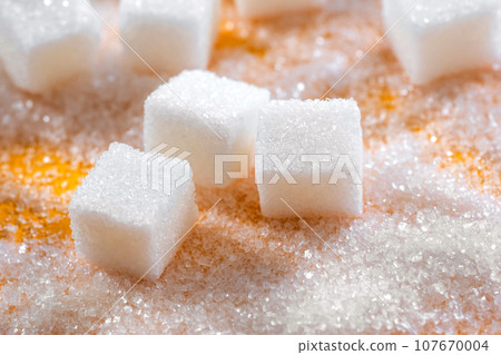Cubes of refined sugar on the table close-up Cubes of refined sugar on the table close-up 107670004