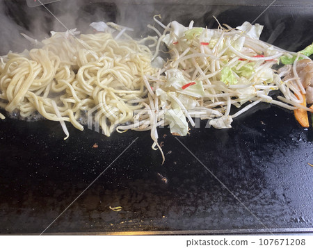 Grill simple pork yakisoba on a griddle Grill simple pork yakisoba on a griddle 107671208