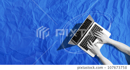 Person using a laptop computer with crumpled paper texture Person using a laptop computer with crumpled paper texture 107673758