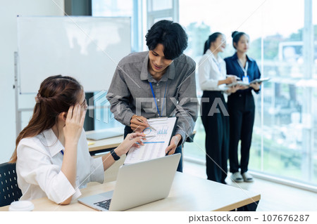 accountant team with laptop and paperwork analyzing financial data report accountant team with laptop and paperwork analyzing financial data report 107676287