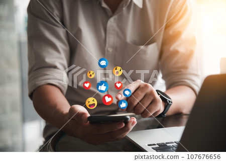 Hand using smartphone with Social media Marketing concept. Digital technology internet online. Hand using smartphone with Social media Marketing concept. Digital technology internet online. 107676656