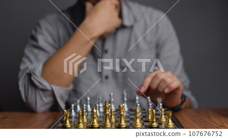 Strategic planning and goals success business idea. Businessman looking at chess at the board. 107676752