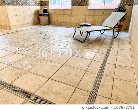 Floor area where a hot tub used to be that has been removed and filled in. 107678791