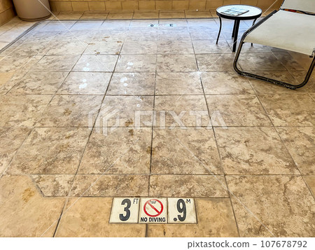 Floor area where a hot tub used to be that has been removed and filled in. Floor area where a hot tub used to be that has been removed and filled in. 107678792