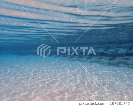 Sandy beach in the sea and beautiful water waves and light 107681745