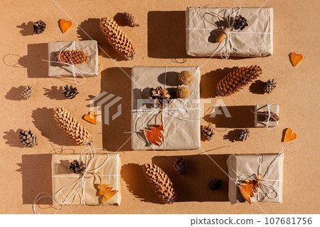 Zero waste Christmas knolling concept flat lay hard shadows. Hand craft eco gift natural New Year decorations top view. Zero waste Christmas knolling concept flat lay hard shadows. Hand craft eco gift natural New Year decorations top view. 107681756