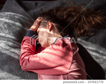 Stressed tired millennial woman on bed eyes closed suffers from headache Mental health Psychology Traumatic experience Stressed tired millennial woman on bed eyes closed suffers from headache Mental health Psychology Traumatic experience 107681776