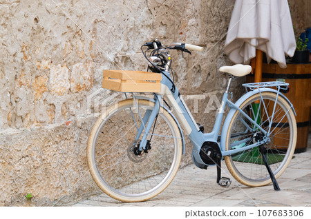 bicycle near the wall on the street bicycle near the wall on the street 107683306