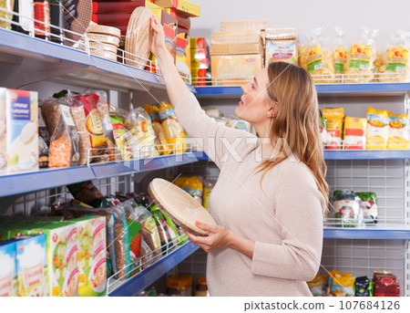 woman customer choosing wafers woman customer choosing wafers 107684126