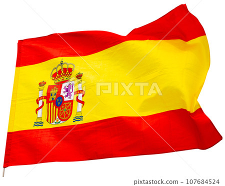 Spain flag on blue sky. Close up waving flag of Spain. Spain flag on blue sky. Close up waving flag of Spain. 107684524