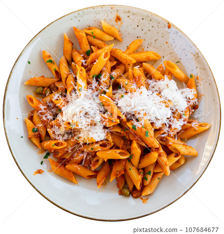 Penne rigate pasta served on platter in tomato sauce Penne rigate pasta served on platter in tomato sauce 107684677