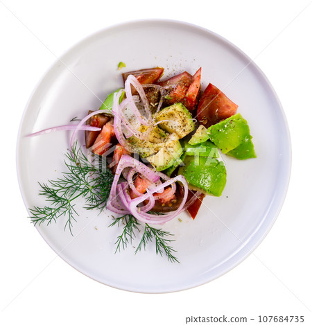 Colorful salad with fresh tomatoes, avocado, onion and herbs Colorful salad with fresh tomatoes, avocado, onion and herbs 107684735