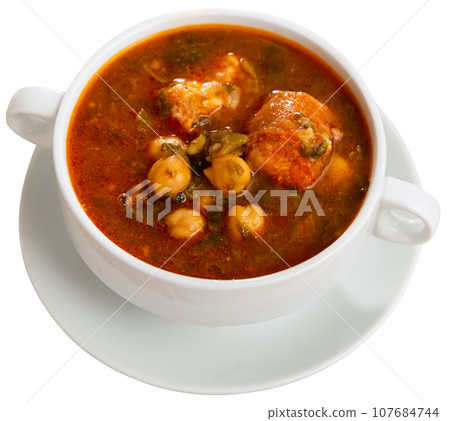 Traditional Spanish soup with beans, chickpeas and meat 107684744